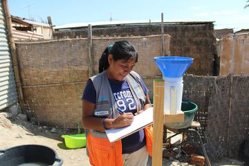 Collection of rainfall data using handmade rain gauge in Peru.